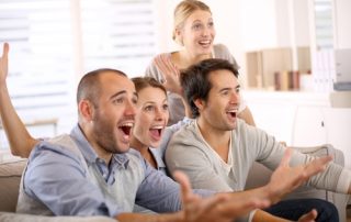 A group of millennials sitting on the couch.
