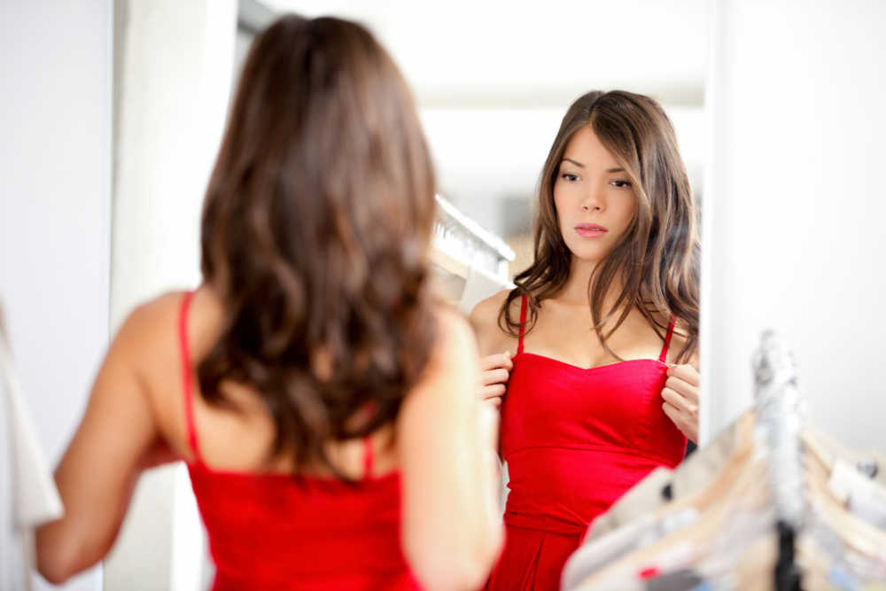 woman in red dress who got breast reconstruction
