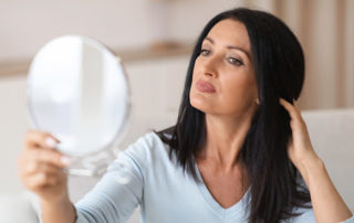 woman has gotten rid of her facial brown spots, veins, and facial hair