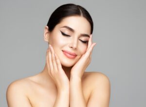 A woman holding her face.